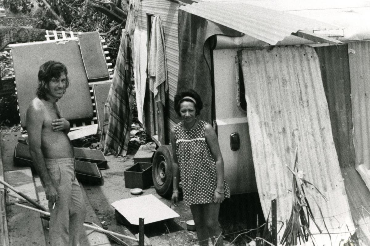 Bill and Polly Day at their van, covered in aluminium sheeting, on corner of McMinn Street