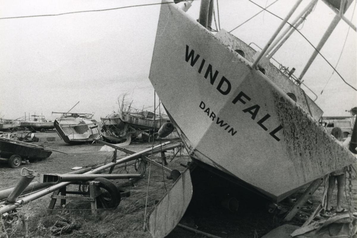 Large sailing boats washed up on beach