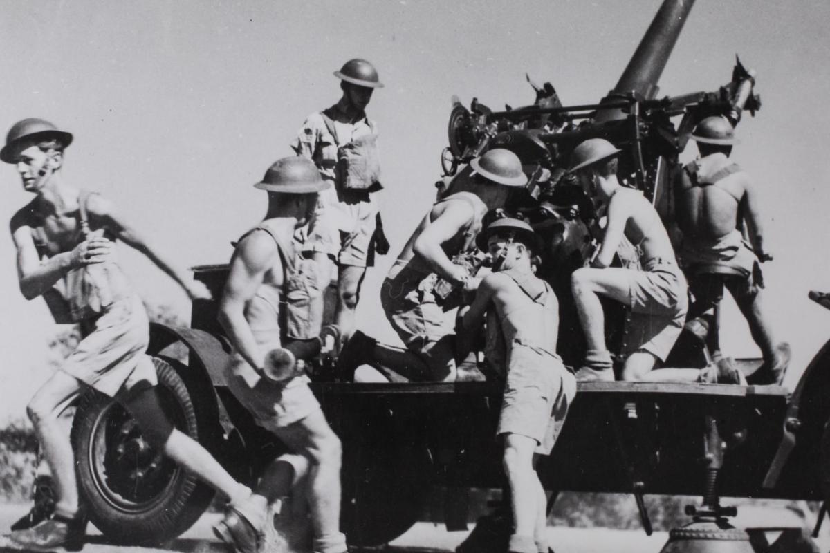 3" mobile anti-aircraft gun (now positioned outside Larrakeyah Army Headquarters) top of cliffs at Darwin oval Esplanade opposite Hotel Darwin. 