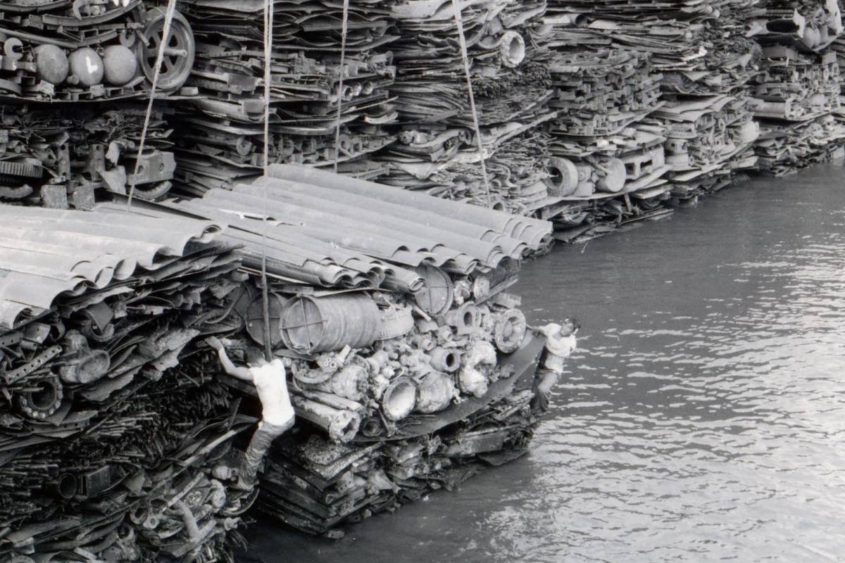 Large stacks of salvaged metal awaiting transportation to Japan.