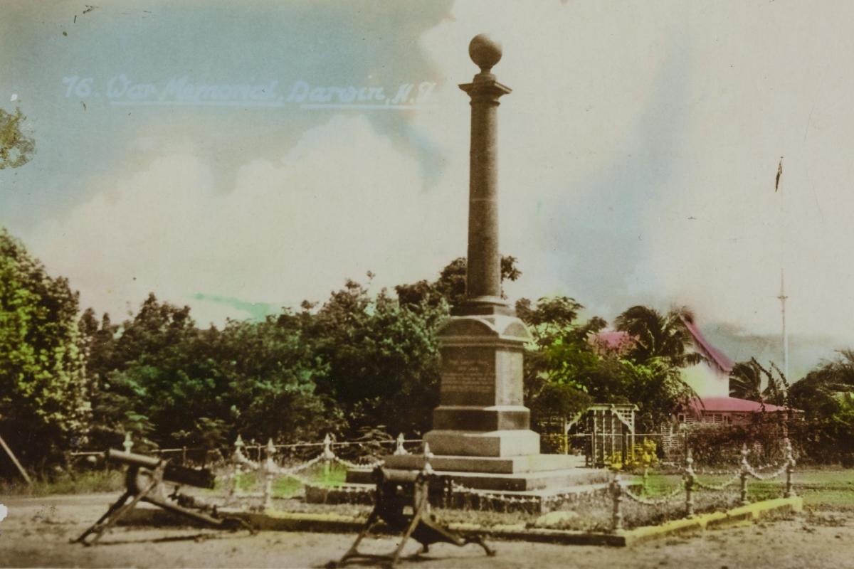 The Cenotaph is at Centre with Government House in the background and two machine guns in the foreground.