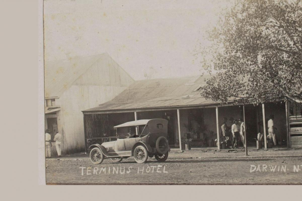 Terminus Hotel in Cavanagh Street. Old car parked out front. Tree of Knowledge to the right.