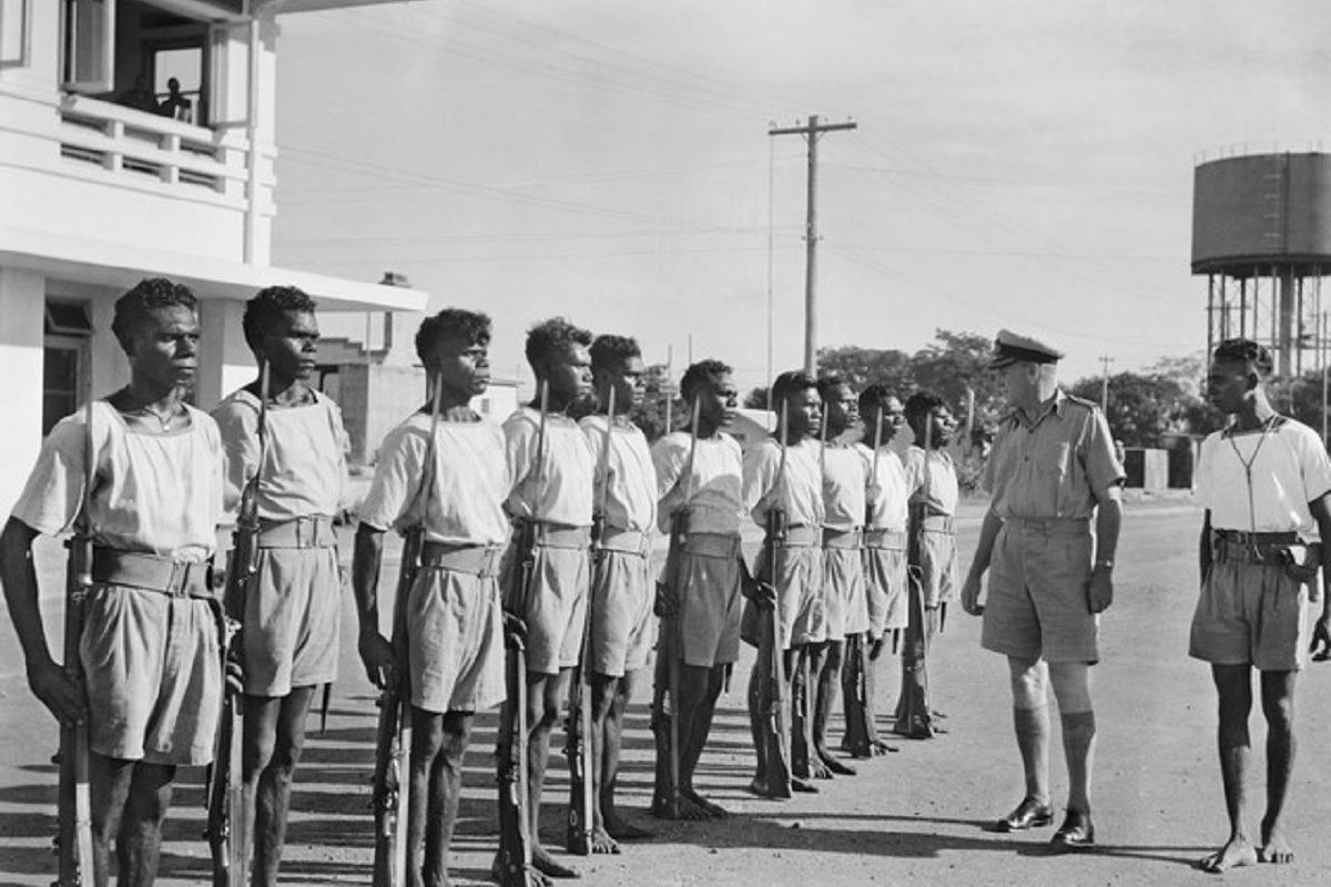 Tiwi Coastwatchers in uniform, standing in a line at HMAS Melville, Darwin.