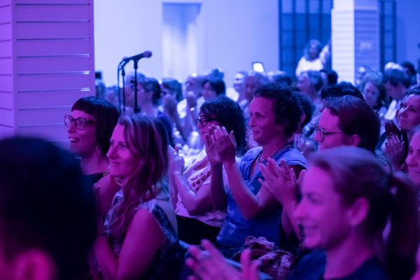 Audience members applauding at SPUN event