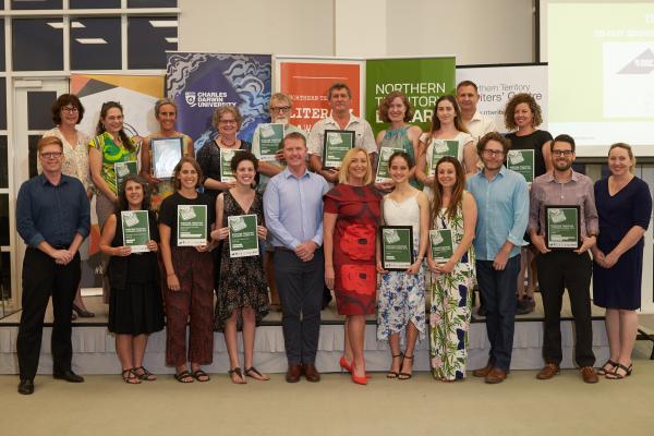 staged photos with two rows of people holding certificates and smiling