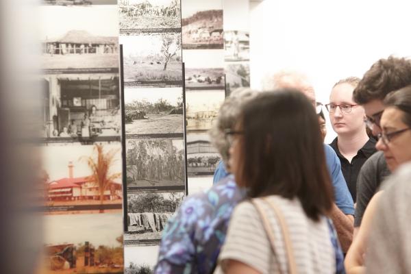 People viewing exhibition photographs