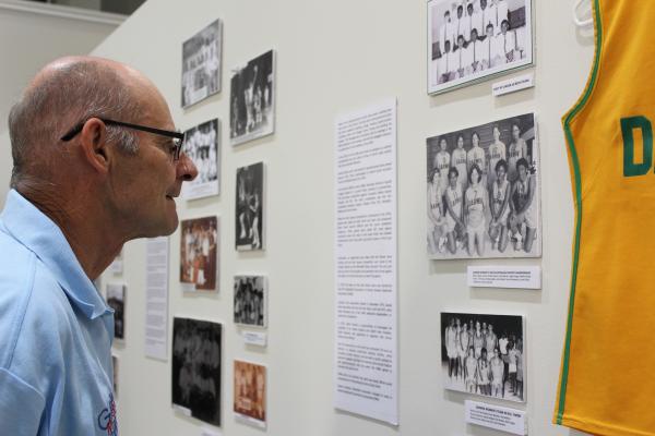 Man intently looking at exhibition