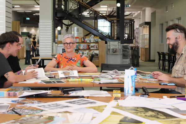 Group of people talking and working