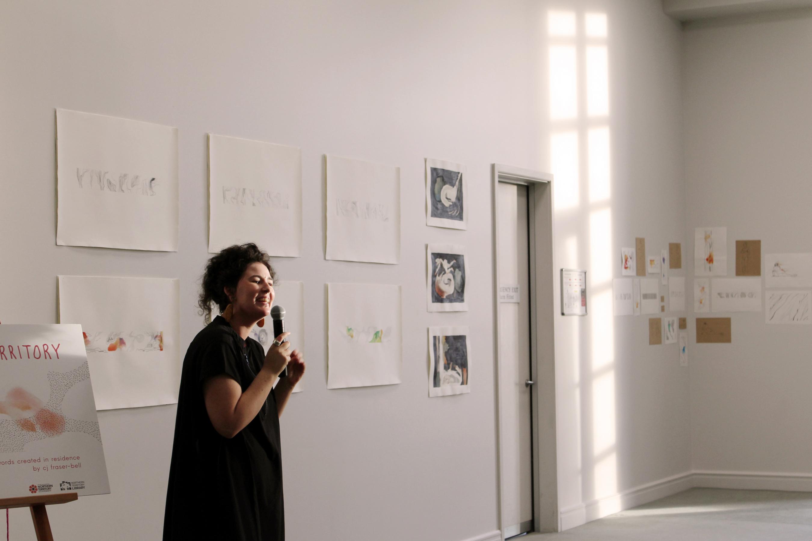 Person speaking with microphone