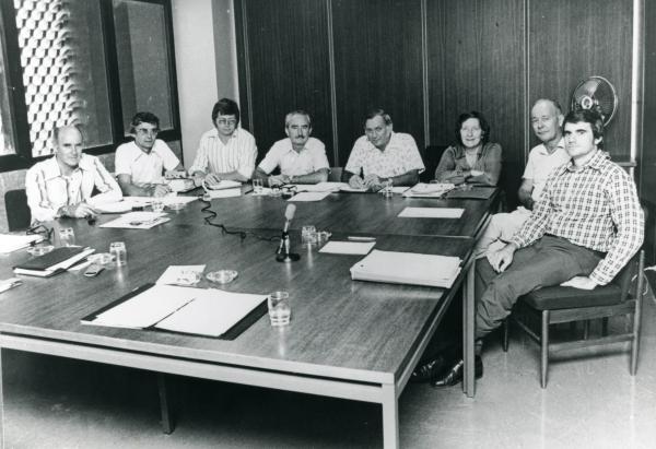 Meeting of Darwin Reconstruction Committee. L-R: Ron Thomas (Construction); Ian Morrison (Housing and Construction Department); Phil Spring; Frank Dwyer (Acting Chairman); John Parsons (General Manager); Dr Ella Stack (Darwin City Council); Vern O'Brien (Dept. of Northern Territory); Grant Tambling (Legislative Assembly).