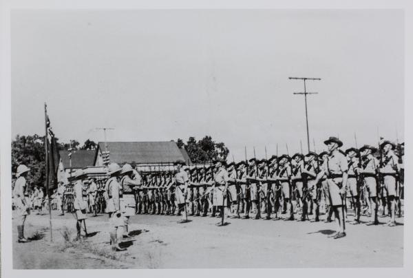 The mobile force salute the colours in Bennett Street.