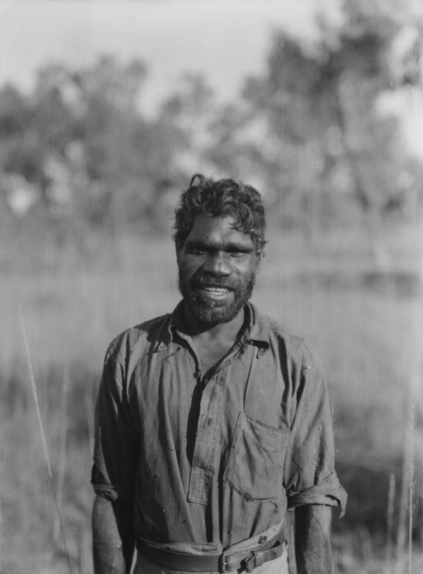 Neighbour, a recipient of the Albert Medal bravery award, Roper River, Northern Territory, 1928. Photographer Herbert Basedow: National Museum of Australia Dr Herbert Basedow Collection object/12360 A smiling portrait of Ayaiga in an Australian bush setting.