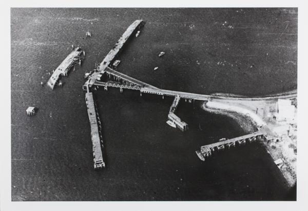 The MV Neptuna lies on its side near Stokes Hill Wharf in Darwin.