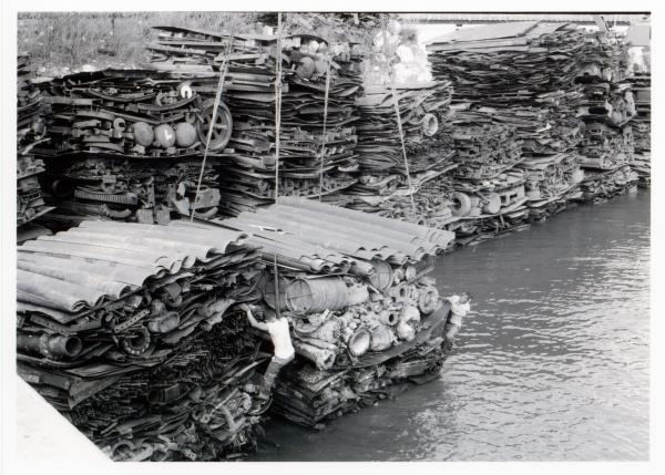 Large stacks of salvaged metal awaiting transportation to Japan.