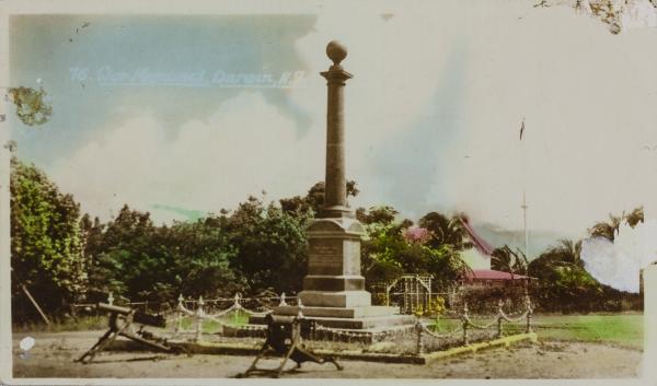 War Memorial Darwin (hand-coloured postcard), c. 1938 Library & Archives NT, William Williams Collection, PH1043/0095 The Cenotaph is at Centre with Government House in the background and two machine guns in the foreground.