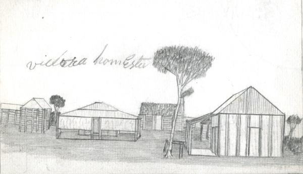 Various station buildings with a tree and horse rail.